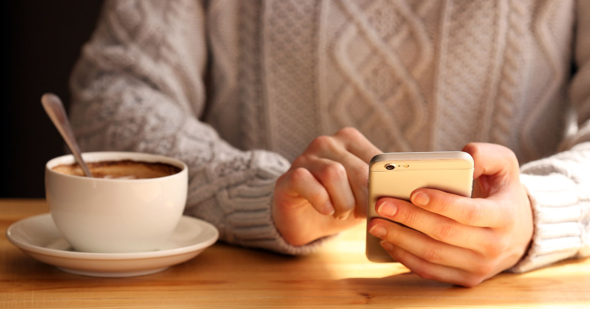 Schedule a text message to send later - image showing woman holding phone