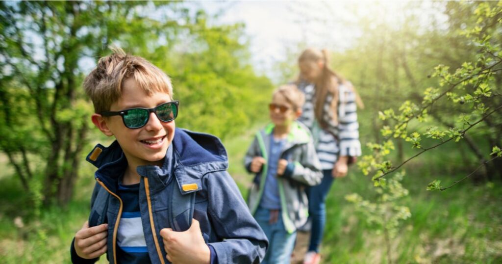 A family having fun hiking together, one of the free family activities ideas